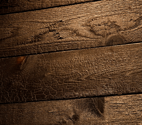 A close-up of salvaged wood used throughout the Uchiko Austin interior.