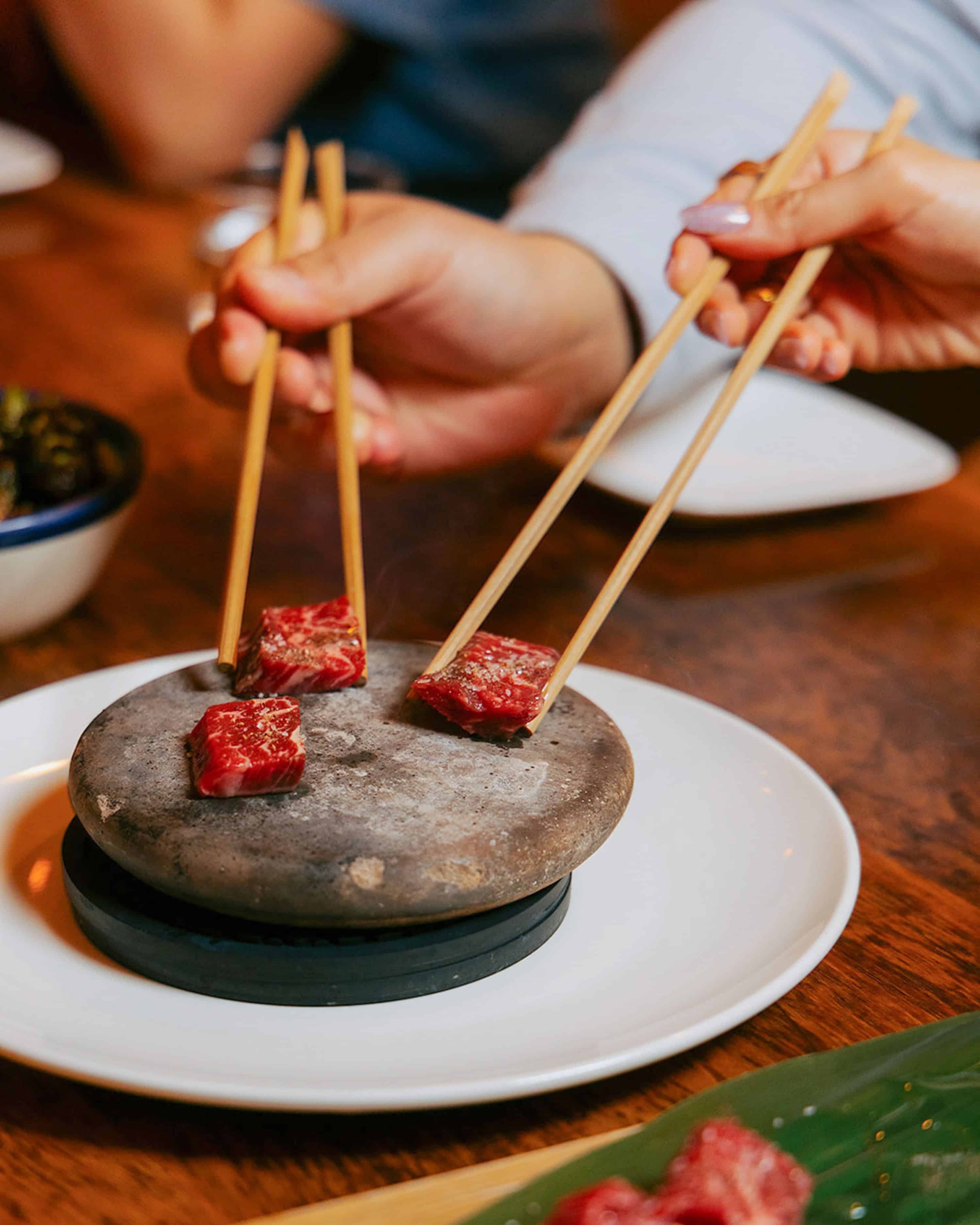 wagyu being cooked on a hot rock