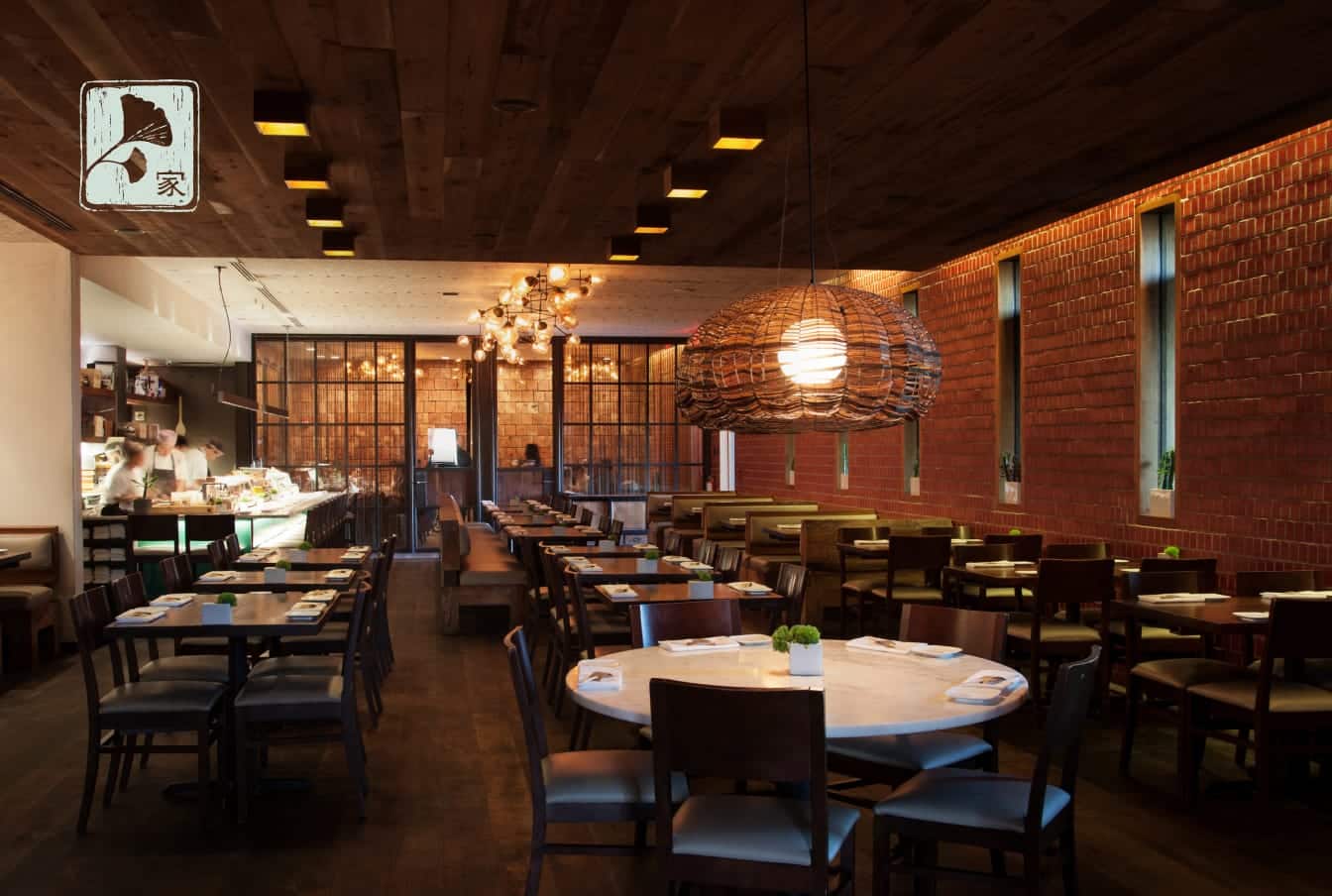 A wide angle view of the dining room and the sushi bar at Uchiko Austin.