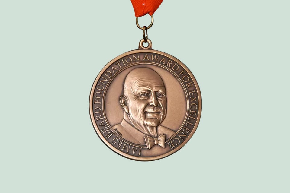 The James Beard Foundation Award For Excellence medal.