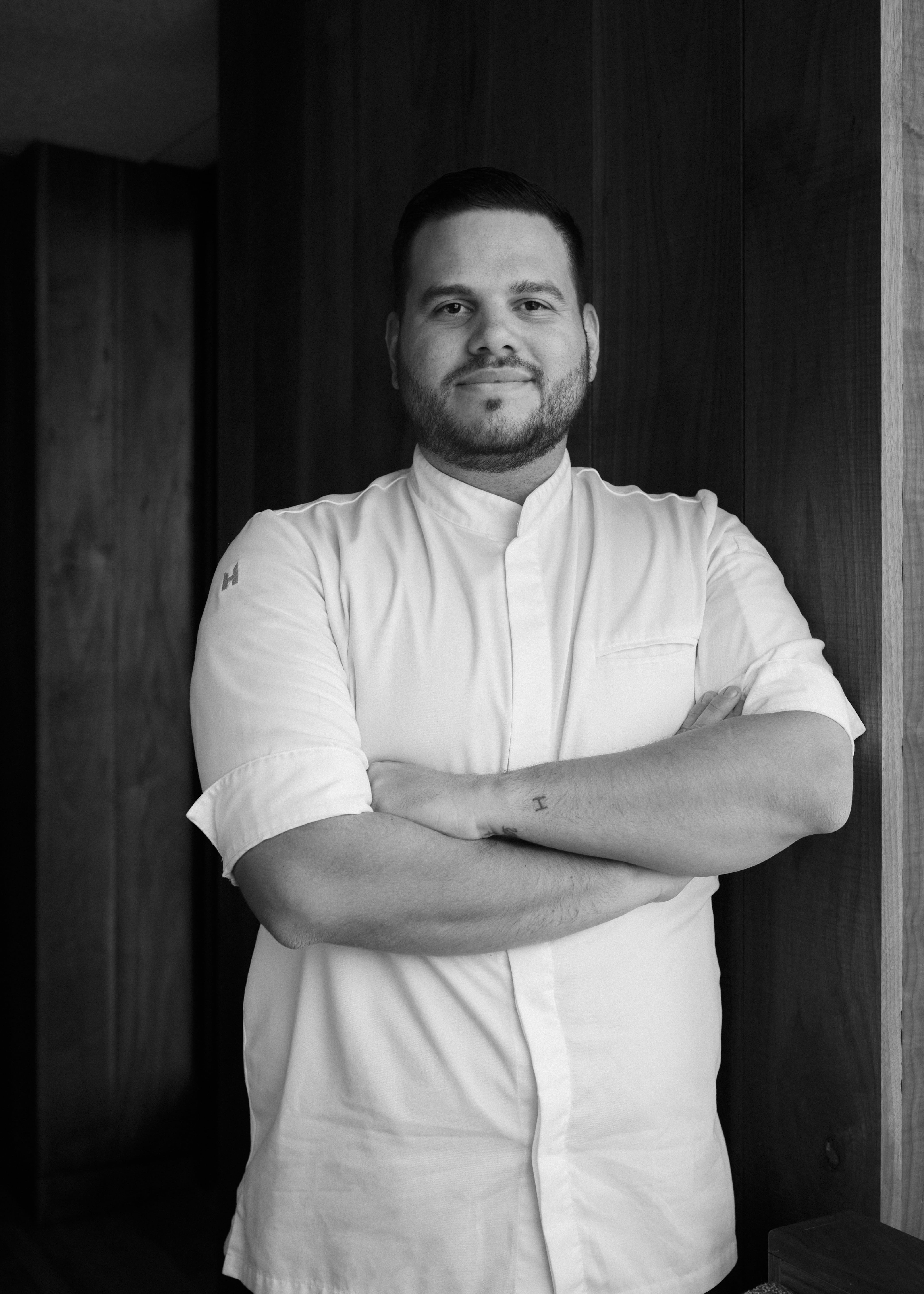 Portrait of chef de cuisine Andres Araujo in uniform at Uchiko Denver Sushi Restaurant